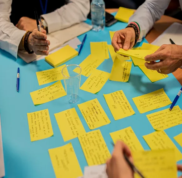 A team mapping out ideas on sticky notes during a planning session